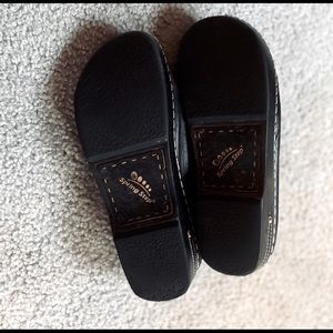 A pair of Spring step clogs